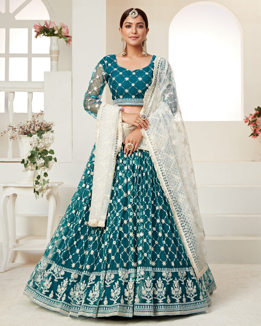 Woman wearing a teal and white traditional outfit with a white background