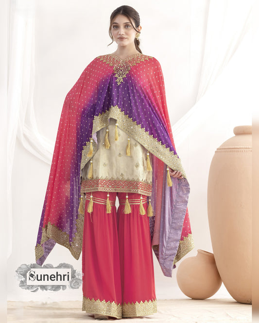 Woman wearing a traditional outfit with a pink and purple dupatta, standing against a white background.