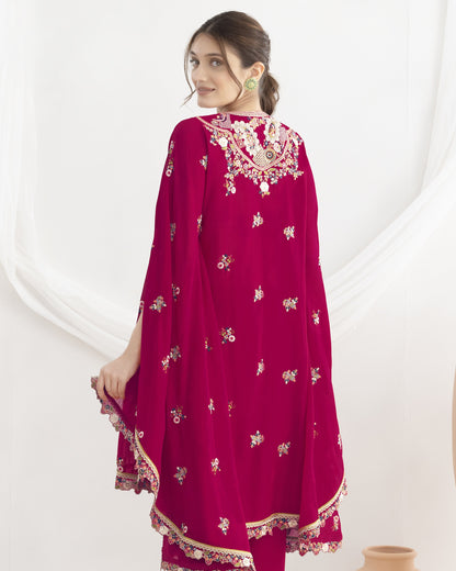 Woman wearing a red embroidered traditional outfit on a white background