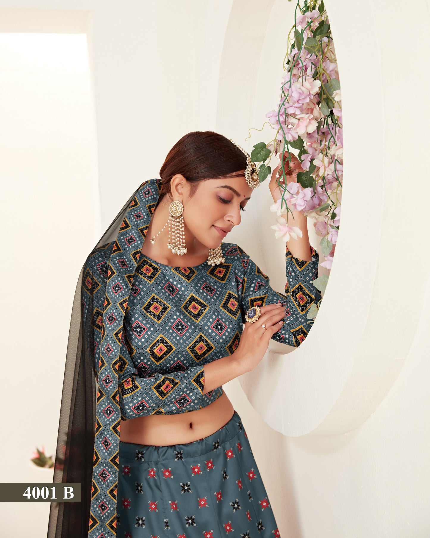 Woman wearing a traditional outfit with a floral headpiece against a white background