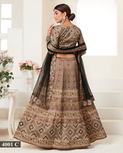 Woman wearing a traditional patterned outfit with a black dupatta in a bright setting.