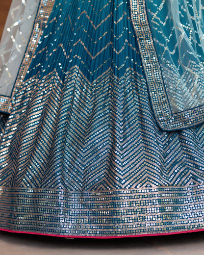 Close-up of a blue and silver patterned fabric with a chevron design.