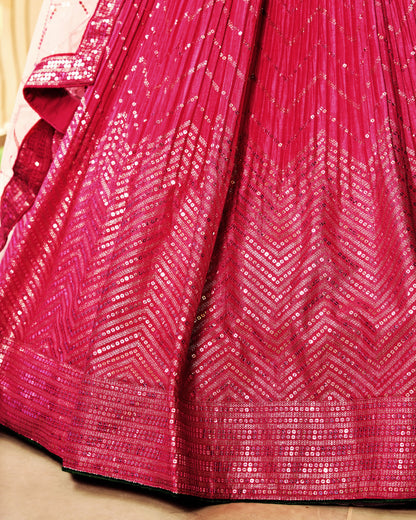 Close-up of a pink saree with a textured pattern