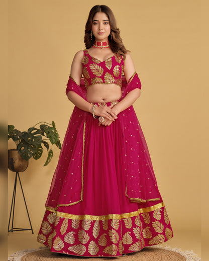 Woman wearing a pink and gold traditional outfit on a beige background