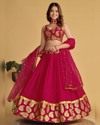 Woman wearing a pink and gold traditional outfit on a yellow background