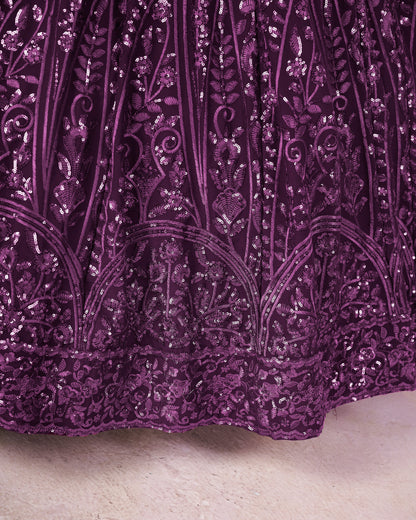 Close-up of a purple sequin fabric with intricate patterns