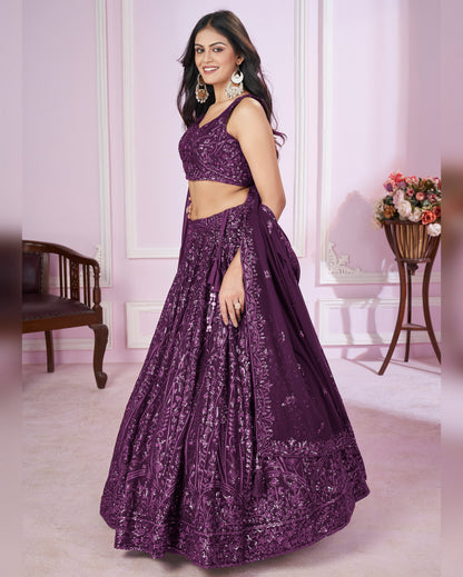 Woman wearing a purple embroidered lehenga in an indoor setting