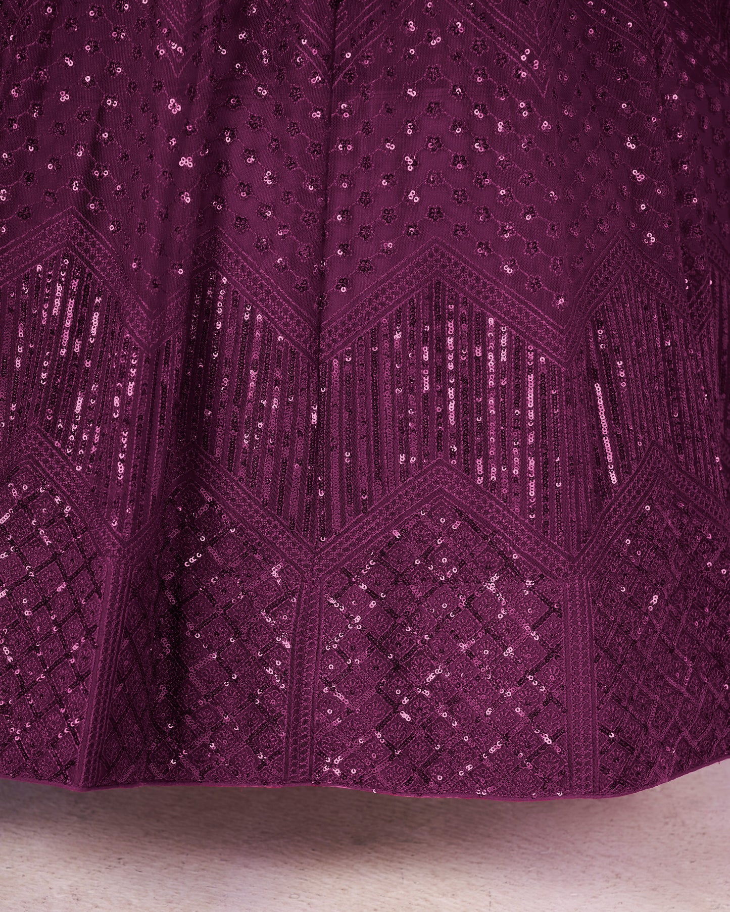 Close-up of a purple textured fabric with geometric pattern