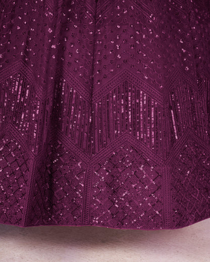 Close-up of a purple textured fabric with geometric pattern