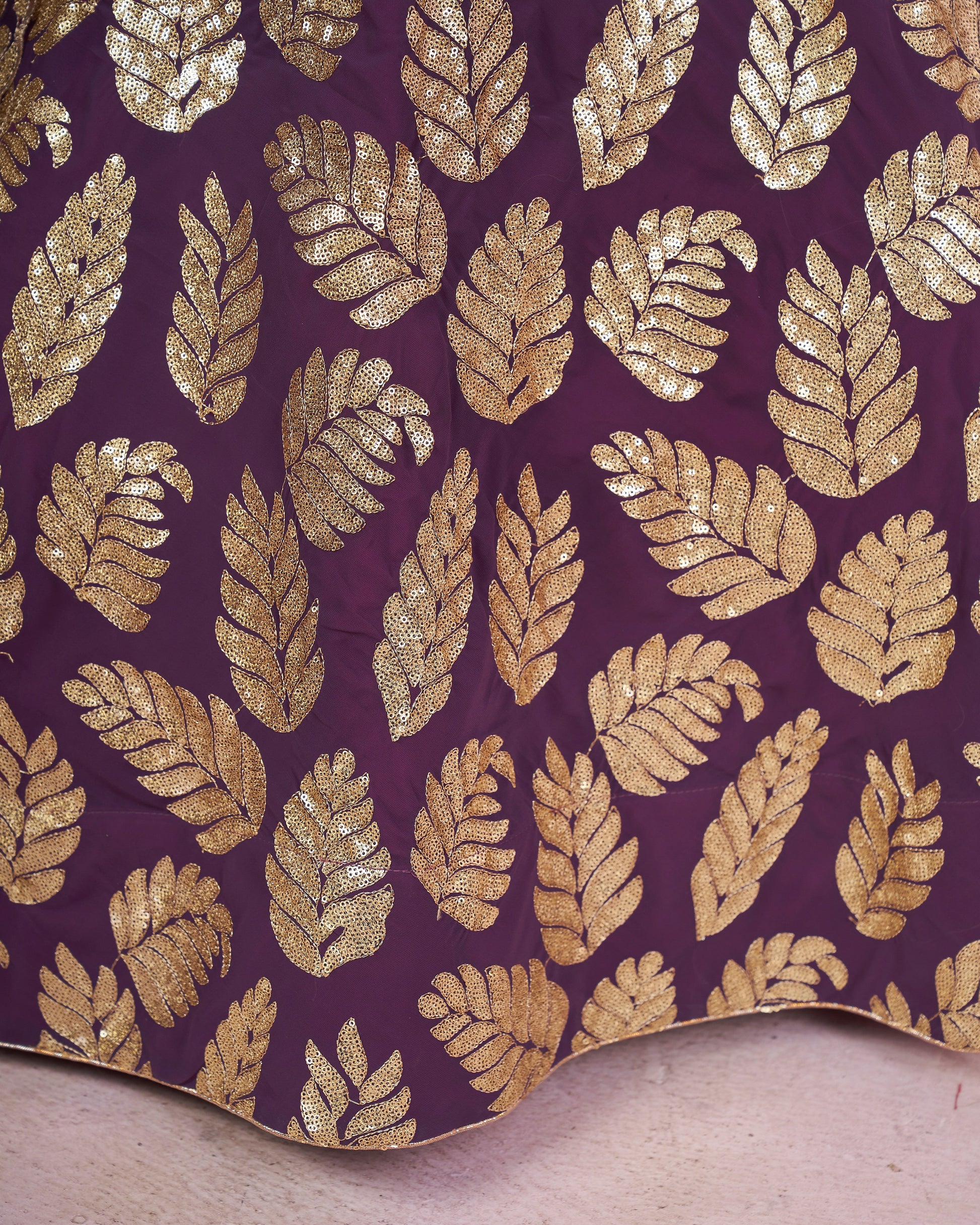 Gold leaf pattern on purple fabric