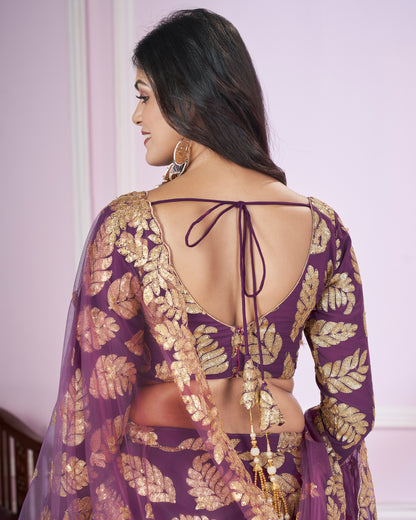 Woman wearing a purple and gold traditional outfit with a backless design.