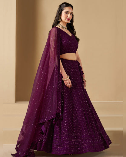 Woman wearing a purple traditional outfit with a beige background