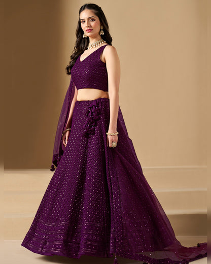 Woman wearing a purple traditional outfit with a beige background