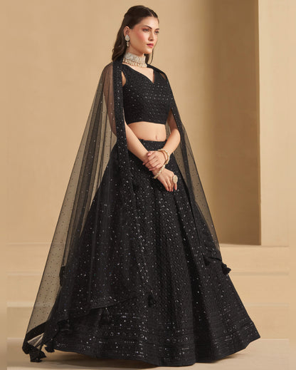 Woman wearing a black traditional outfit with a beige background