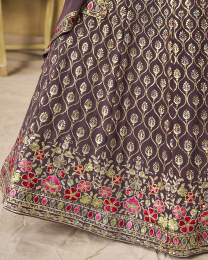 Close-up of a dark fabric with floral embroidery on a light background