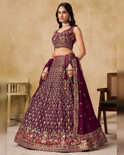 Woman wearing a traditional purple embroidered outfit with a beige background