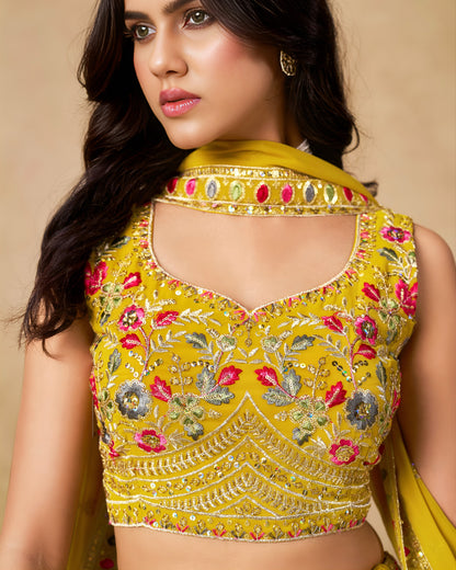 Woman wearing a yellow embroidered blouse with a beige background