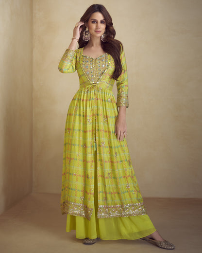 Woman wearing a yellow traditional outfit with intricate designs on a beige background