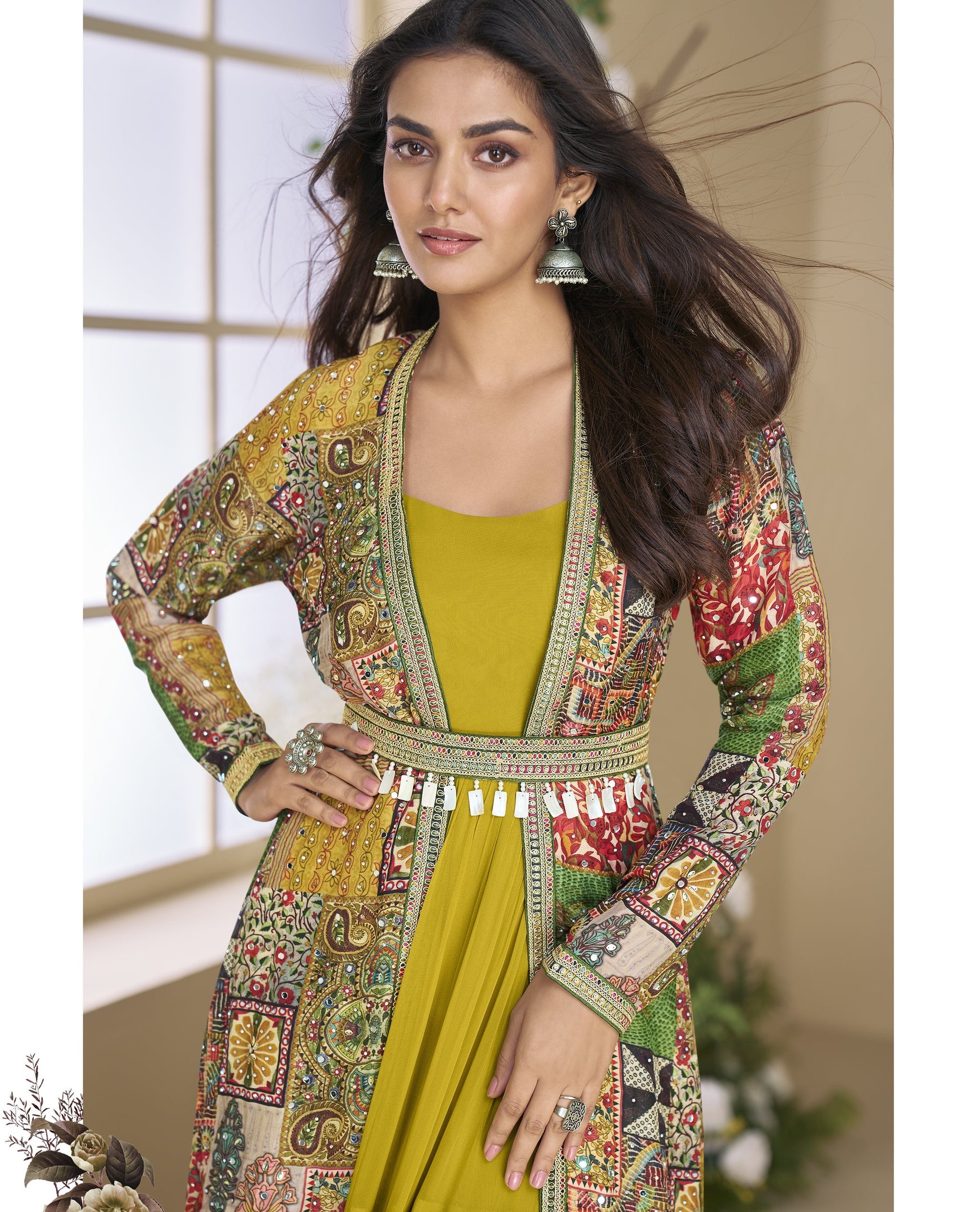 Woman wearing a colorful traditional outfit with a mustard yellow dress.