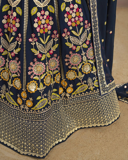 Navy blue fabric with intricate floral embroidery on a beige background