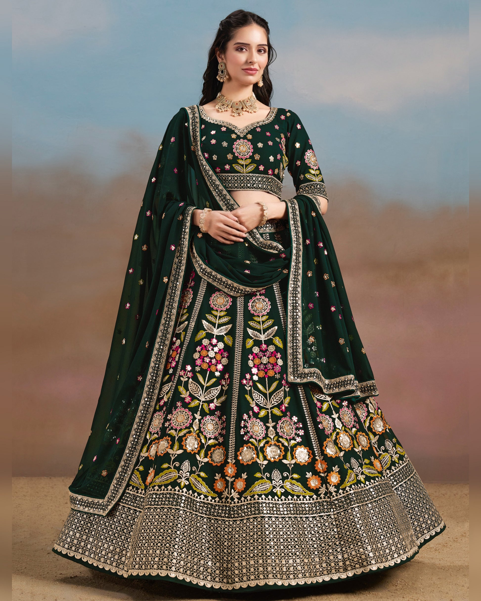 Woman wearing a dark green embroidered traditional outfit with a blurred background