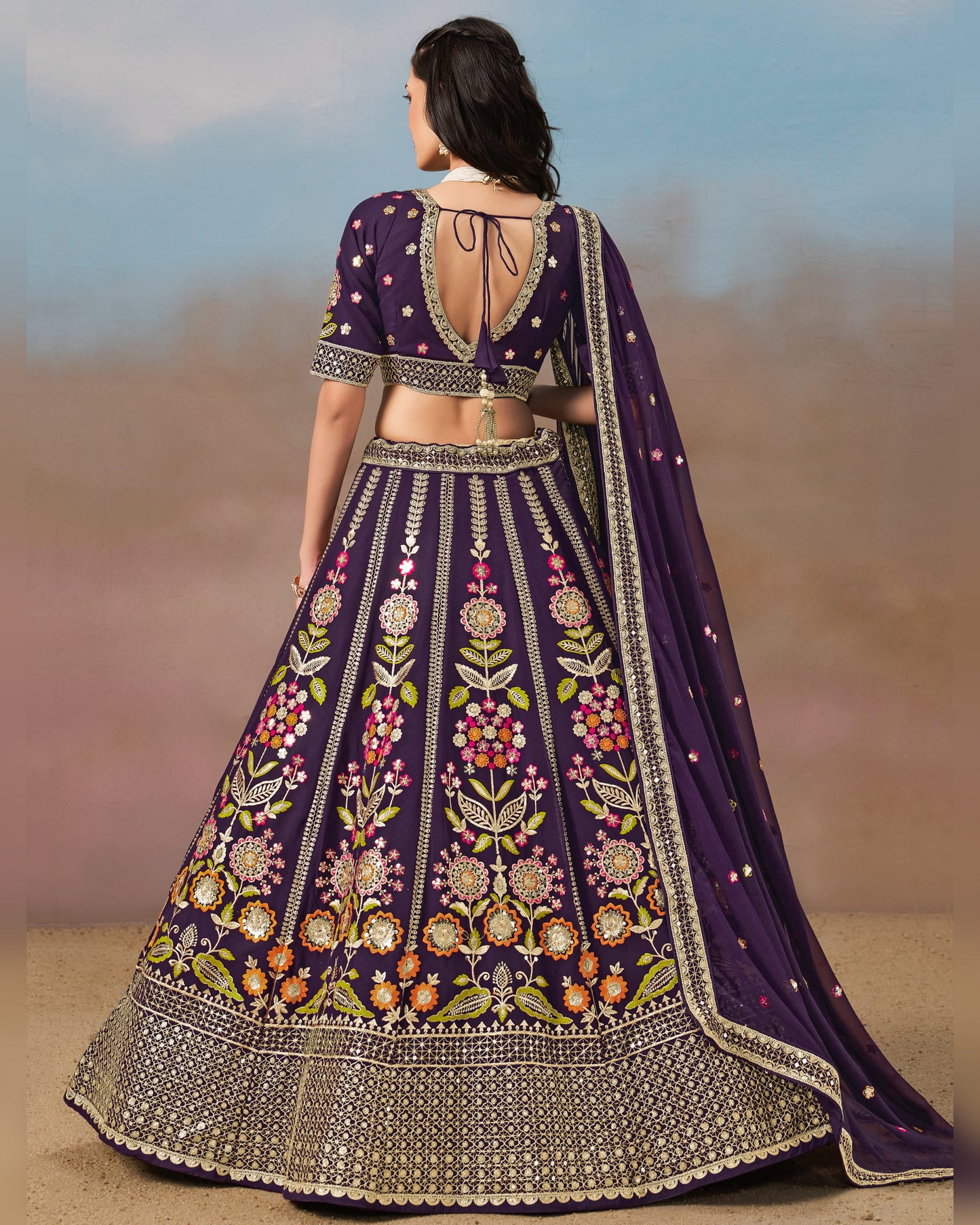 Woman wearing a purple embroidered traditional outfit with a blurred background