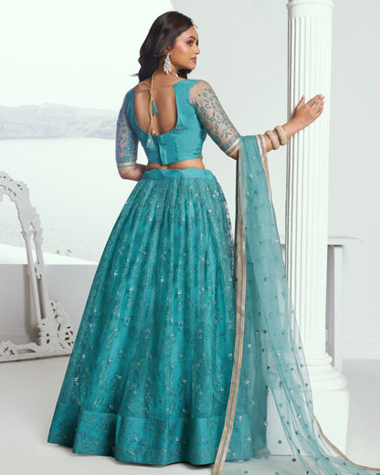 Teal traditional outfit with a matching dupatta on a white background