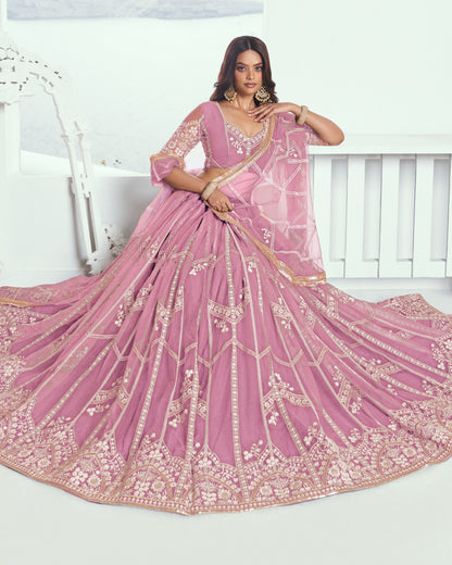 Pink embroidered saree with a white background