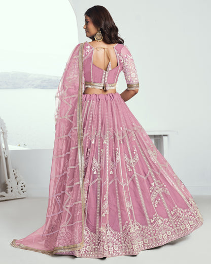 Pink embroidered lehenga with a white background