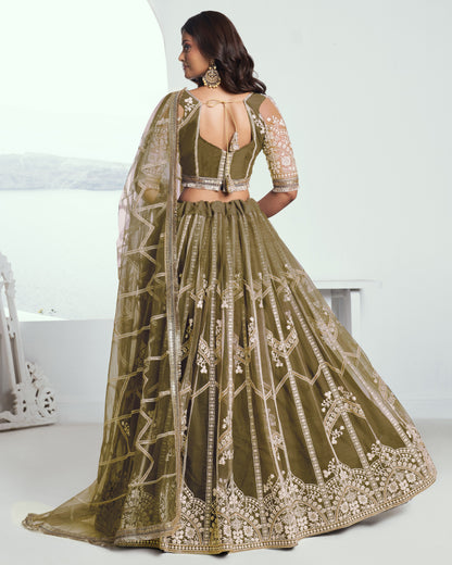 Green embroidered lehenga with a matching blouse on a white background