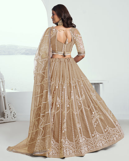 Beige embroidered lehenga with a white background