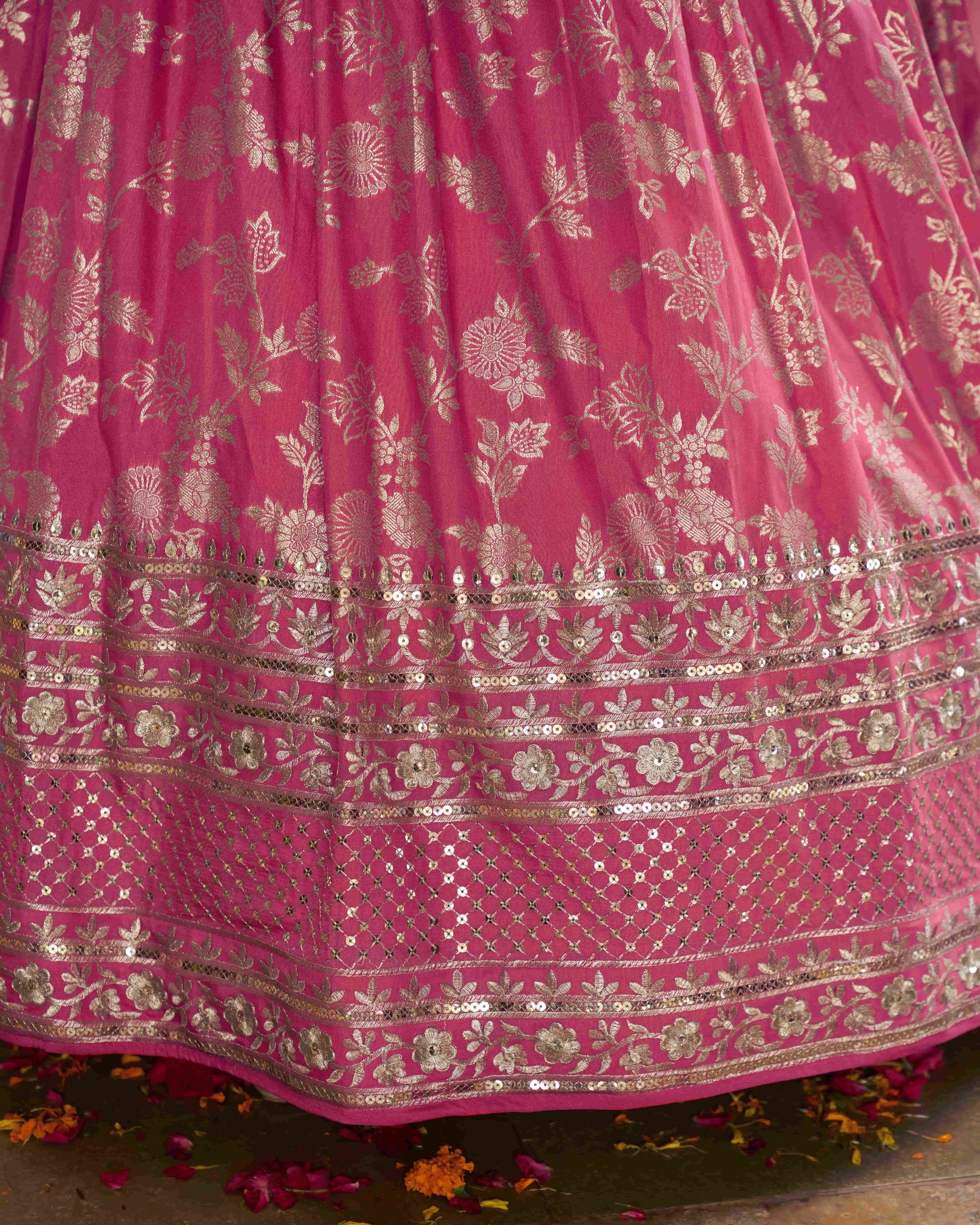 Pink fabric with gold embroidery and patterns