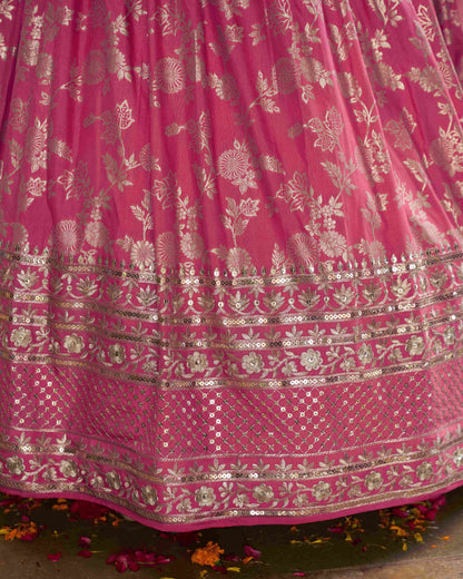 Pink fabric with gold embroidery and patterns