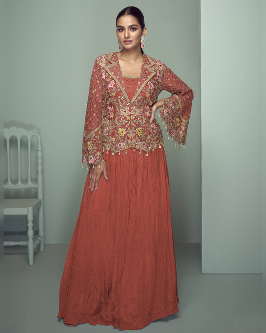 Woman wearing a red embroidered outfit in a minimalistic setting