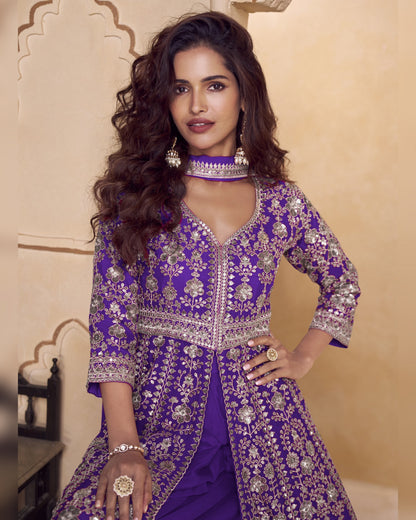 Woman wearing a purple embroidered traditional outfit with a beige background