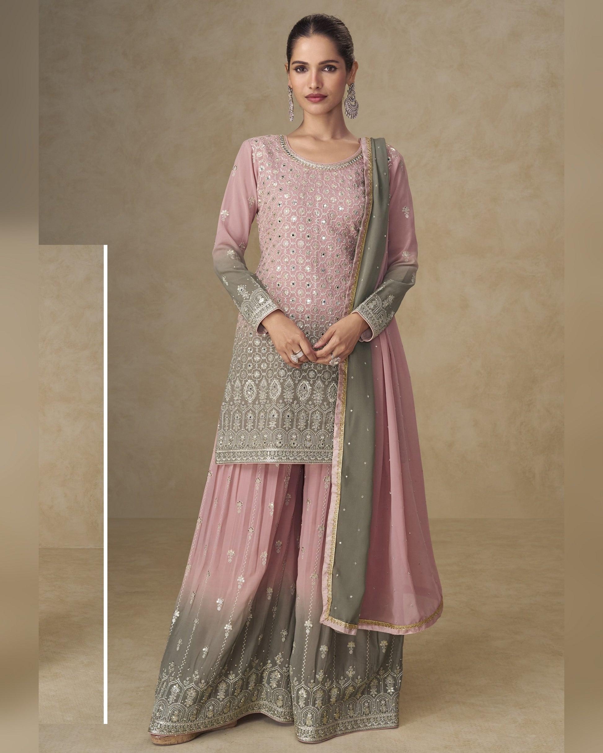 Woman wearing a traditional outfit with pink and gray patterns on a beige background