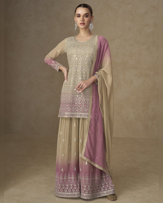 Woman wearing a traditional outfit with a beige and pink dupatta on a brown background