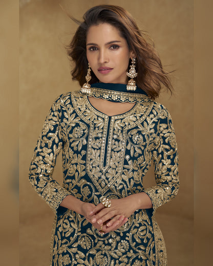 Woman wearing a traditional embroidered outfit with gold details on a beige background