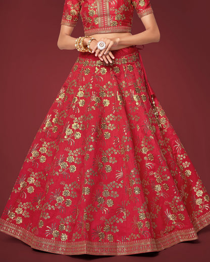 Red traditional outfit with gold embroidery on a red background