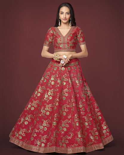 Woman wearing a red embroidered traditional outfit on a dark background