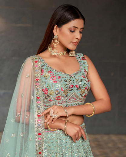 Woman in a traditional outfit with intricate embroidery and jewelry against a dark background