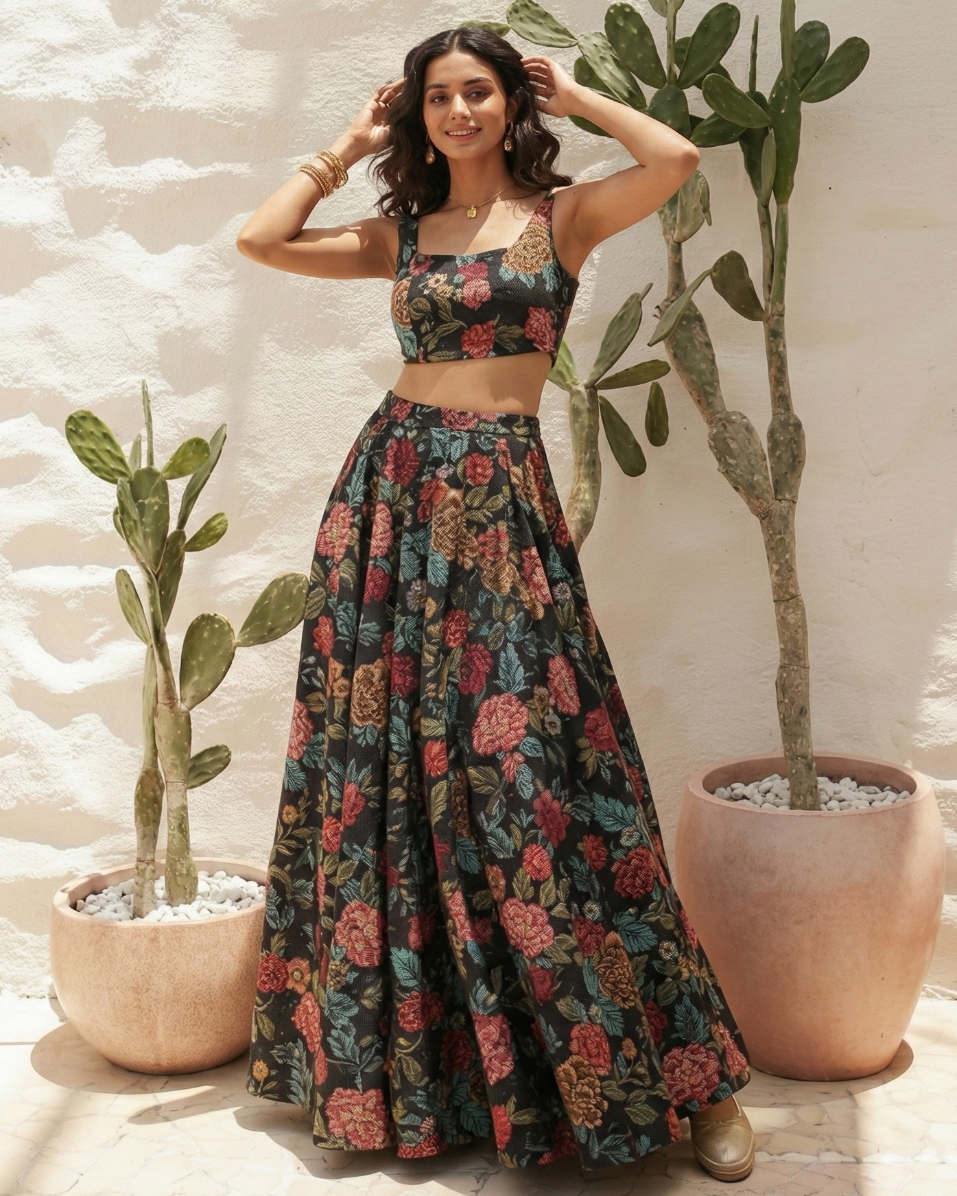 Woman in a floral dress standing next to potted plants against a light-colored wall.