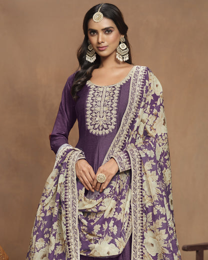 Woman wearing a traditional outfit with purple and beige patterns on a brown background