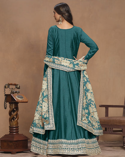 Teal traditional outfit with floral patterns on a brown background