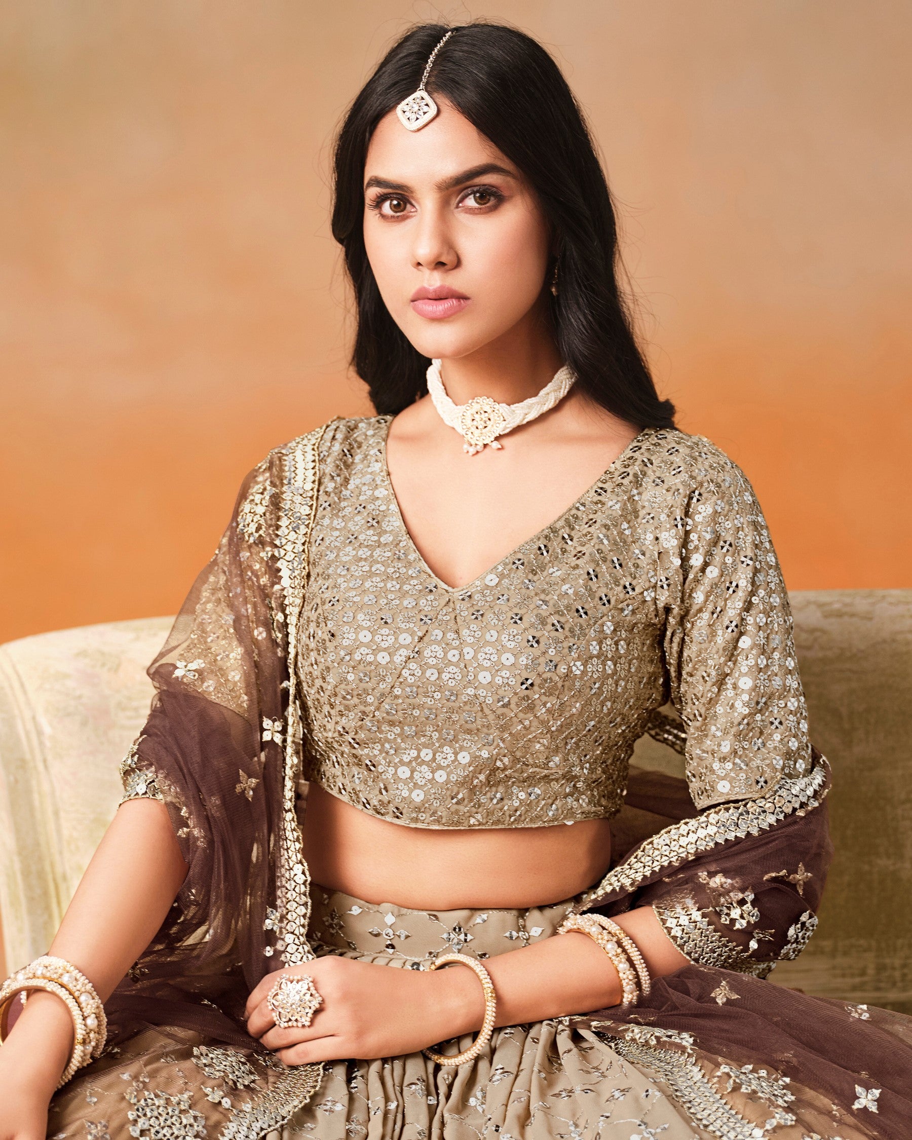 Woman in traditional attire with a warm background