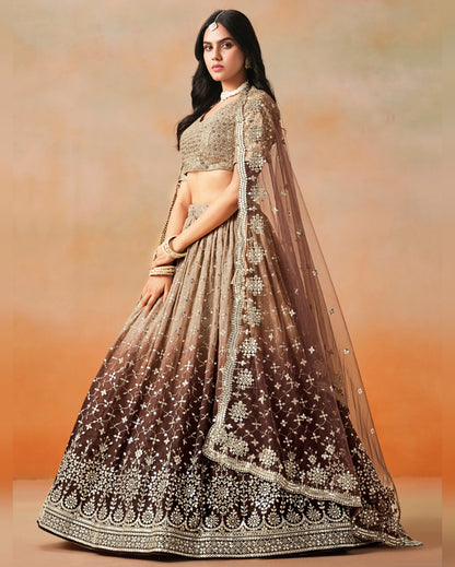 Woman wearing a traditional outfit with a gradient design against an orange background