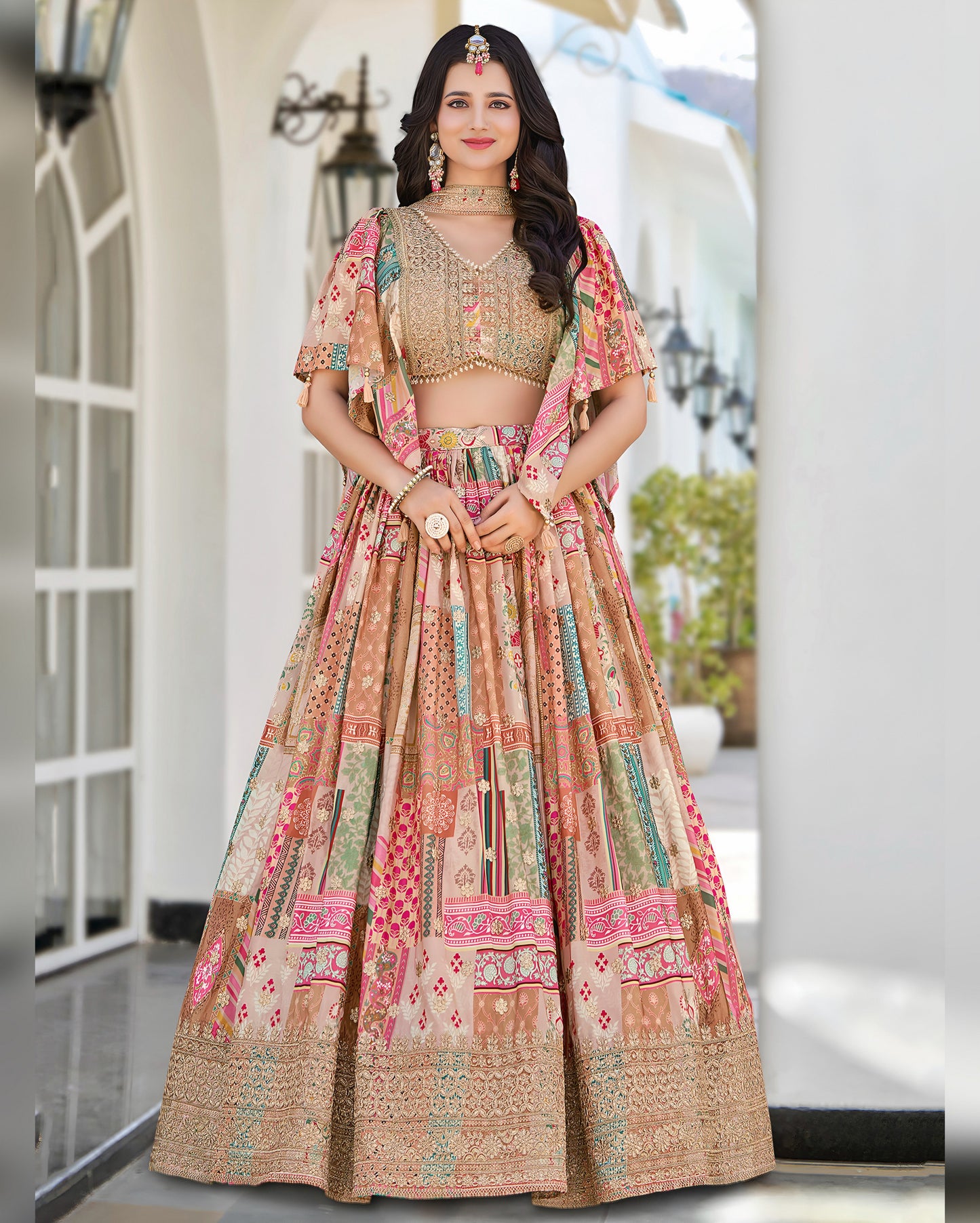 Woman wearing a traditional multicolored lehenga with a matching blouse in an outdoor setting.