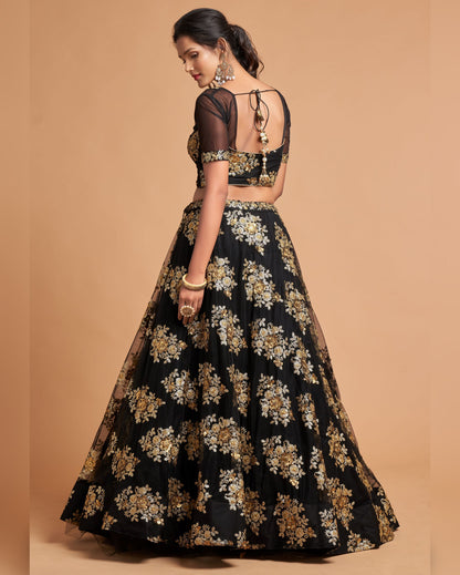 Woman wearing a black floral embroidered outfit on a beige background