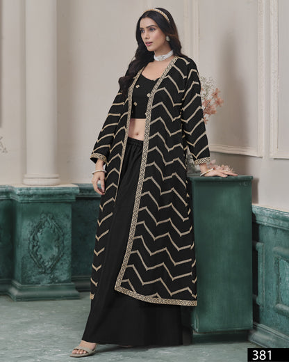 Woman wearing a black and gold patterned outfit in an elegant interior setting