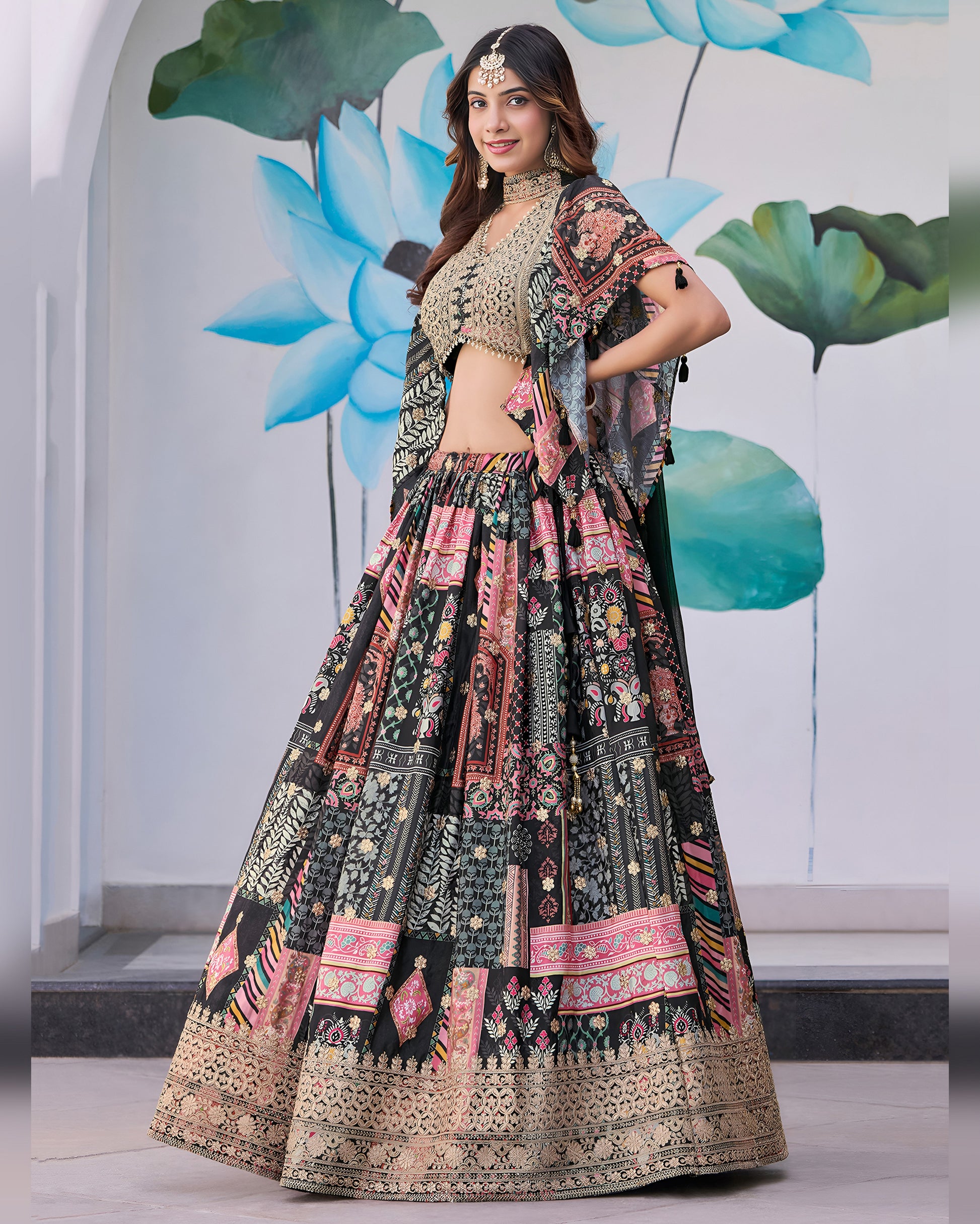Woman in a traditional outfit with floral patterns against a decorative background